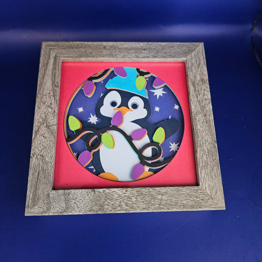 Penguin Holding Lights Shadowbox
